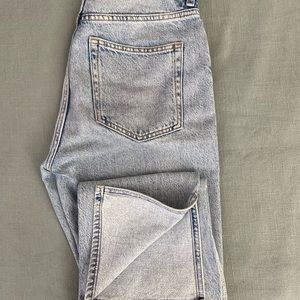 Light wash H&M jeans with slit on bottom perfect for boots!